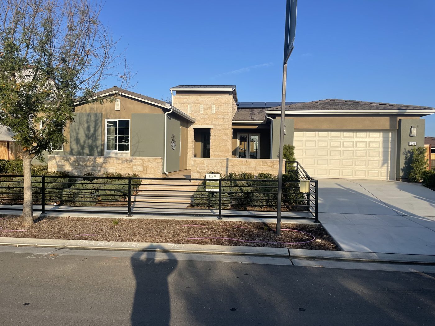 Completed production home — stucco exterior with landscaping