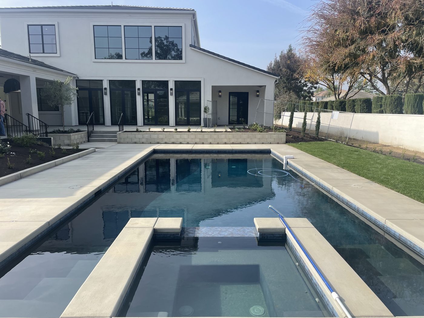 Luxury custom home — white plaster with pool view