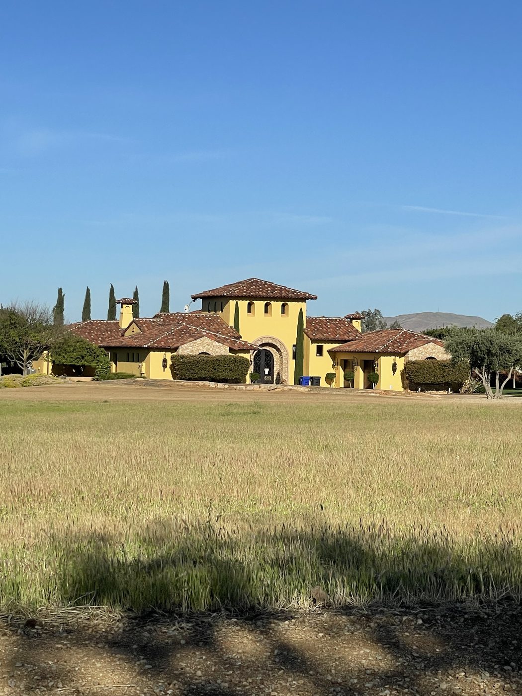 Spanish-style stucco estate with tile roof