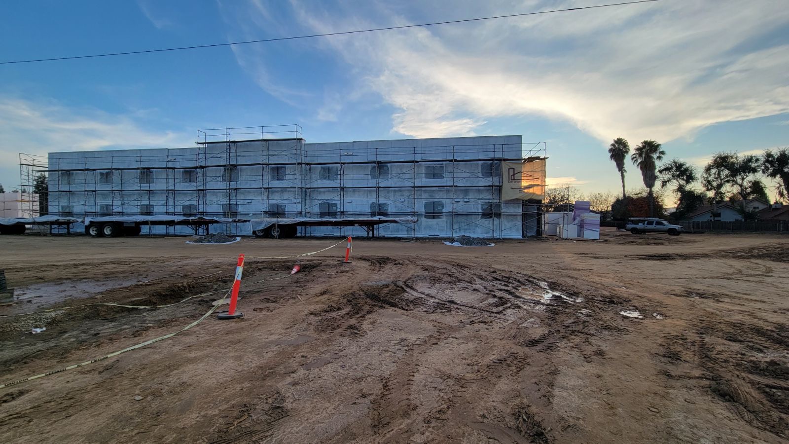 Three-story residential building — stucco application in progress